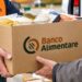 La consegna dei pacchi con i beni di prima necessità del Banco Alimentare